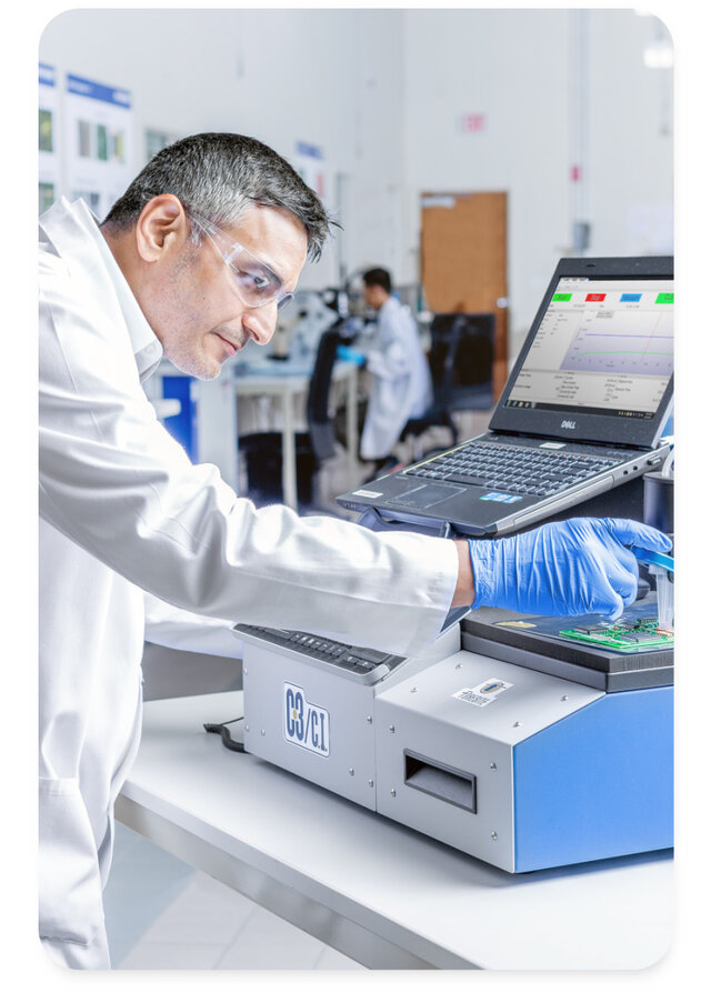 engineer using the c3 machine to test a pcb using ion chromatography 