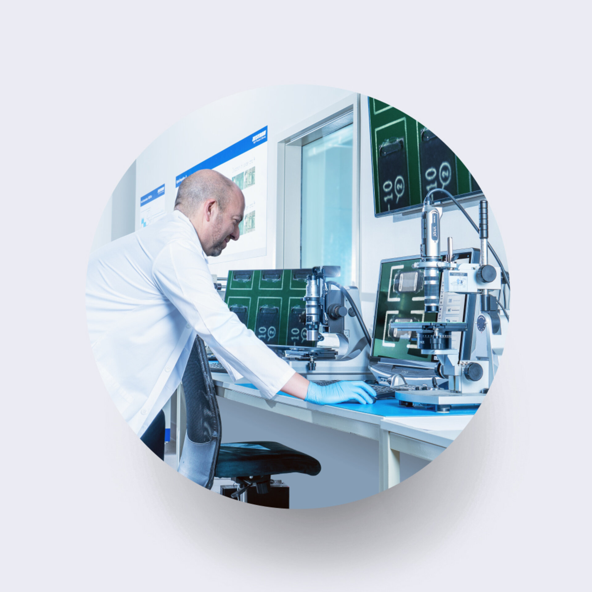 Denis Barbini - Technical Solutions Manager at Zestron US looking at flux on a visual inspection microscope 