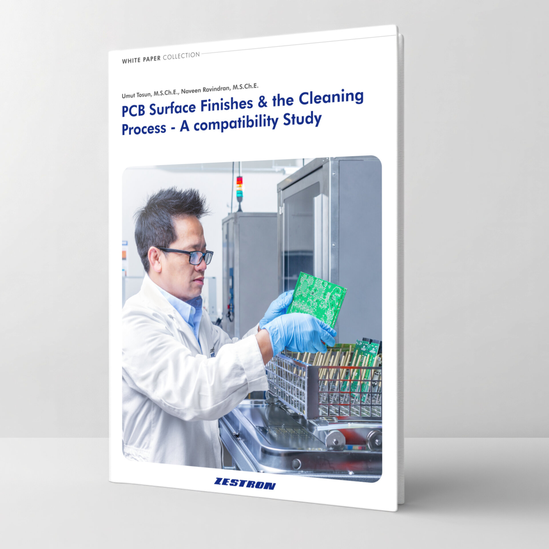 zestron engineer putting a pcb into a batch cleaning machine 