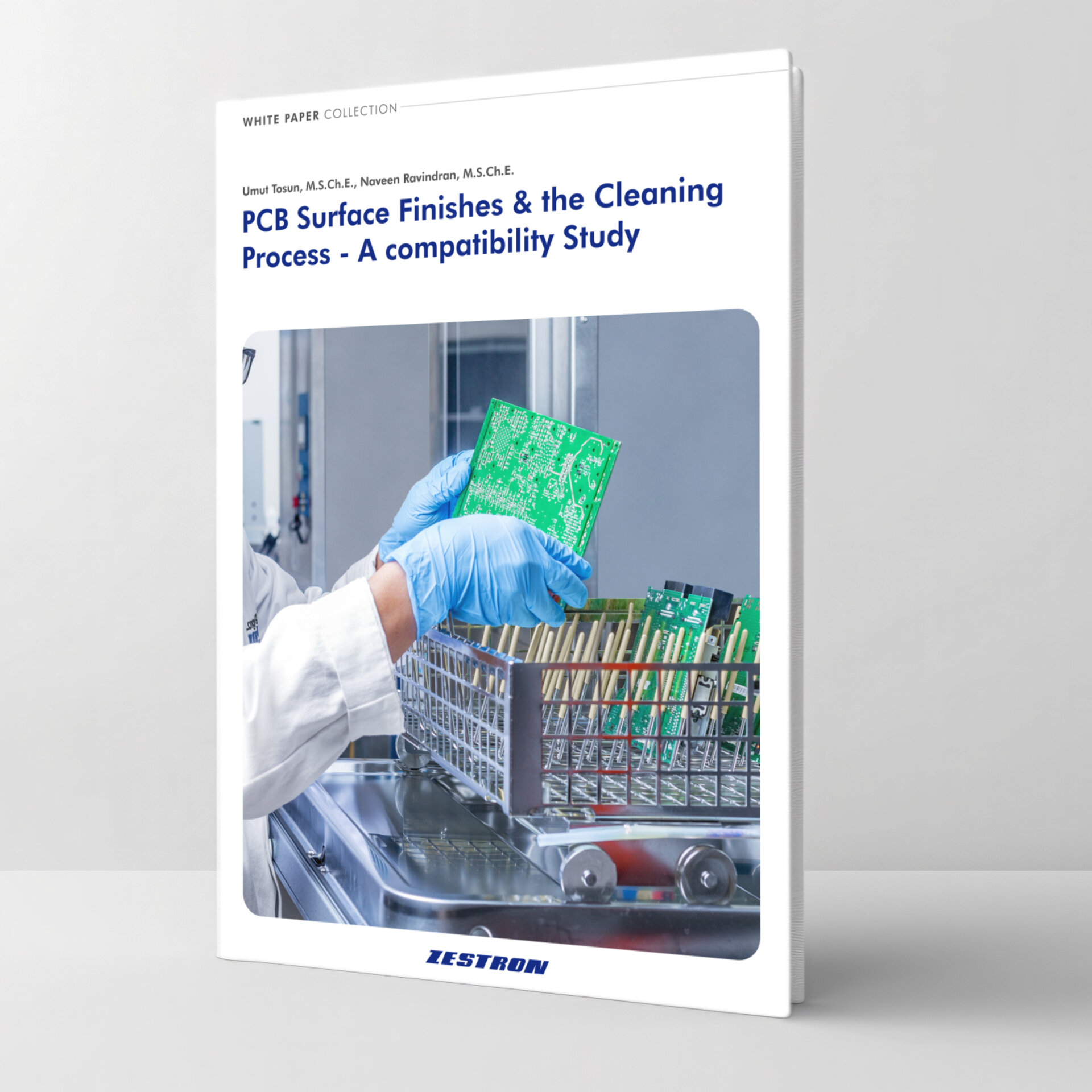 zestron engineer putting a pcb into a batch cleaning machine 